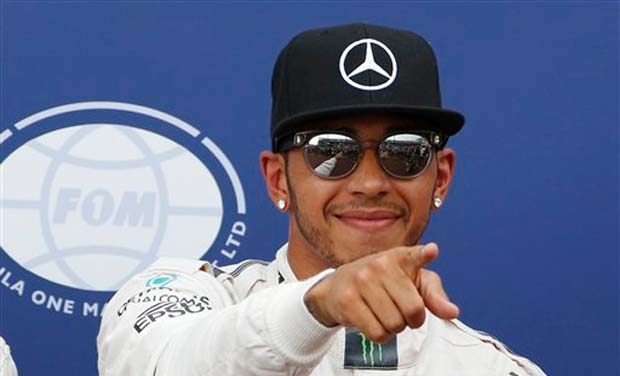Mercedes driver Lewis Hamilton of Britain gestures after setting the pole position after the qualifying session at the Monaco racetrack, in Monaco (Photo: AP) Mercedes driver Lewis Hamilton of Britain gestures after setting the pole position after the qualifying session at the Monaco racetrack, in Monaco (Photo: AP)